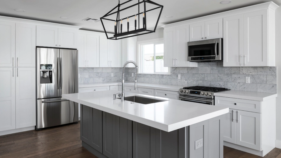 white kitchen with white cabinets and a grey countertop with a white cover